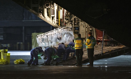 Ebola patient Pauline Cafferkey is wheeled on to a plane to be transported to London
