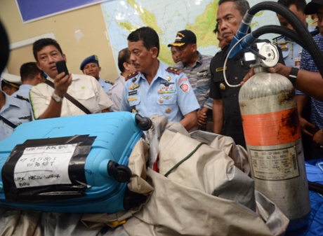 Members of the Indonesian Air Force show items retrieved from the Java sea during search and rescue operations for the missing AirAsia flight QZ8501, in Pangkalan Bun on December 30, 2014 Central Kalimantan, Indonesia.