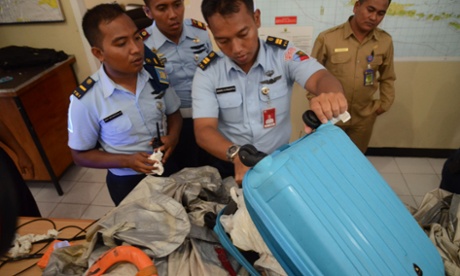 Members of the Indonesian Air Force show items retrieved from the Java sea during search and rescue operations for the missing AirAsia flight QZ8501, in Pangkalan Bun on December 30, 2014 Central Kalimantan, Indonesia.