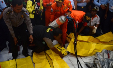 Members of the Indonesian Air Force show items retrieved from the Java sea during search and rescue operations for the missing AirAsia flight QZ8501, in Pangkalan Bun on December 30, 2014 Central Kalimantan, Indonesia.