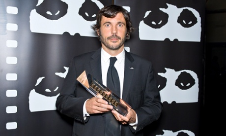 CHICAGO, IL - OCTOBER 18:  Director Diego Quemada-Diez pics up the Gold Hugo for Best New Director at the awards ceremony at the 2013 Chicago International Film Festival at W Chicago on October 18, 2013 in Chicago, Illinois.  (Photo by Timothy Hiatt/Getty Images)CelebritiesFilm