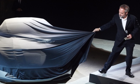 And the rabbit has completely disappeared … Sam Mendes unveils the Aston Martin car which will feature in Spectre, the 24th James Bond movie.