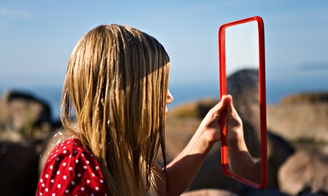 Girl looking in a mirror