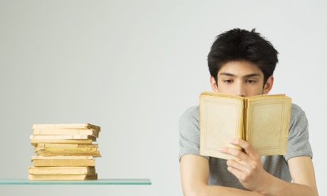 Young man reading books