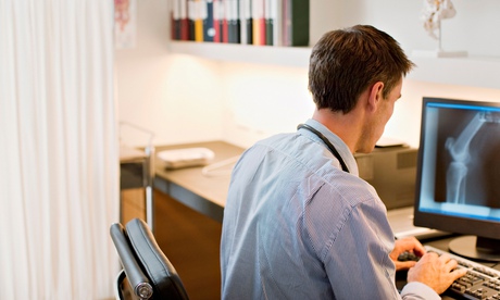 Doctor reviews x-ray