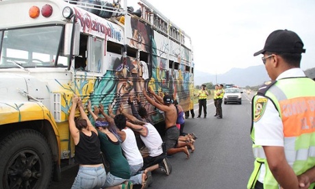 A bus carrying Ecuadorian environmental activists is stopped by police en route to Lima climate talks