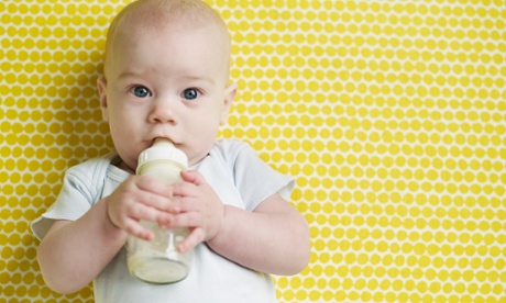 baby drinking from bottle