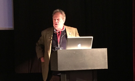 Gavin MacFadyen talking at The Logan Symposium.