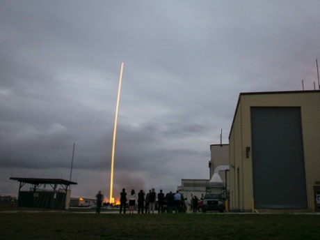 Orion team members watch their baby lift off from Cape Canaveral Air Force Station's Space Launch Complex 37 at at 7:05 EST in this long-exposure sho
