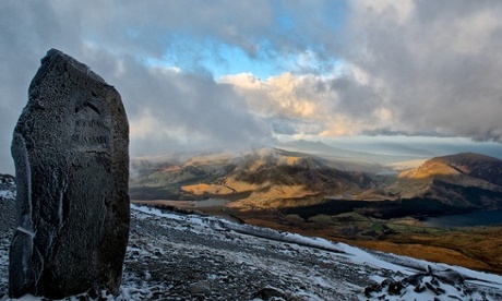 After a 3AM start i'd reached the top of Snowdon, only to be greeted by snow thick cloud and a very strong wind.