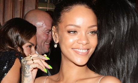 Rihanna with pointy green fingernails