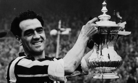 Newcastle captain lifts trophy. (Kids, ask granny or grandad.) It's Joe Harvey with the FA Cup in 1952.