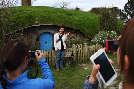 Tourists on the set of Hobbiton.