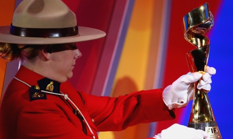 OTTAWA, QC - DECEMBER 06:  The FIFA Woman`s World Cup Trophy is carried by a Officers of the Royal Canadian Mounted Police during the Final Draw for the FIFA Women's World Cup Canada 2015 at Canadian Museum of History on December 6, 2014 in Ottawa, Canada.  (Photo by Alexander Hassenstein - FIFA/FIFA via Getty Images)FootballSoccerFIFA World Cup