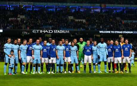 Teams line up for Football Remembers, celebrating the 1914 Christmas Truce prior to kickoff.