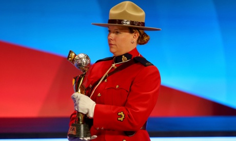 The FIFA Woman`s World Cup Trophy is carried by a Mountie at the draw in Ottawa.