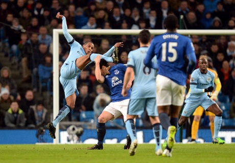 Fernando goes in with a high foot on Everton's Gareth Barry.