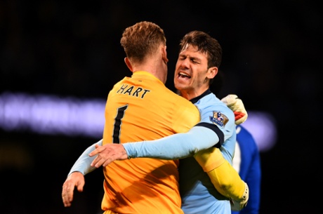 Martin Demichelis celebrates with Joe Hart.