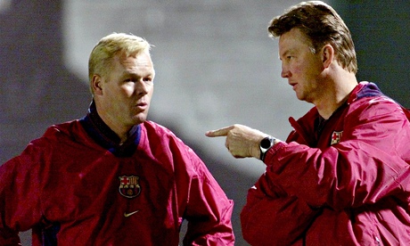 RONALD KOEMAN LISTENS TO BARCELONA COACH LOUIS VAN GAAL.