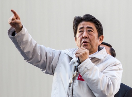 Japanese Prime Minister Shinzo Abe speaks to a crowd of voters during the lower house election campaign rally at a train station in Tokyo, Japan, 07 December 2014.