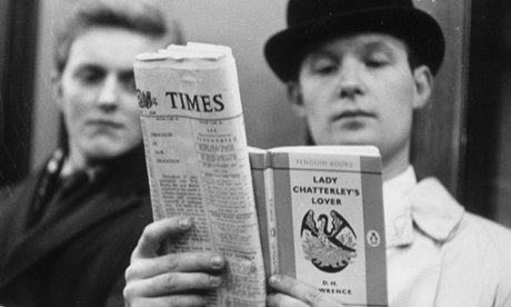 A posed photo of a man reading DH Lawrence’s Lady Chatterley’s Lover on the day the book went on general sale in 1960