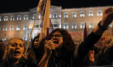 Protesters shout slogans during a parliamentary vote on Greece's 2015 budget in Athens. Photo: Marios Lolos/Xinhua Press/Corbis.