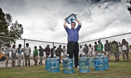 A lot of bottle: Chris Kemper, principal of the school in Seville, which has had to rely on delivered water.