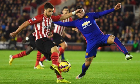 Shane Long is closed down by Marcos Rojo.