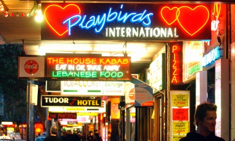 Neon signs light up Darlinghurst Rd in Kings Cross.