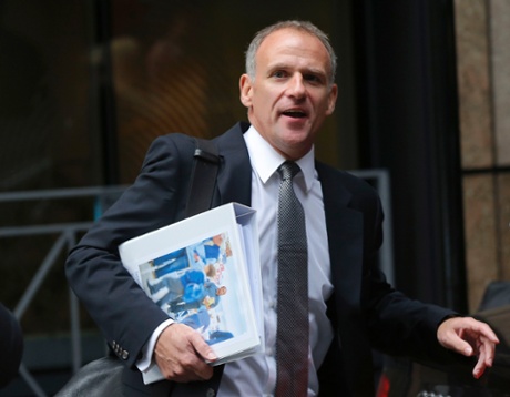 Tesco chief executive Dave Lewis leaves an office, after the announcement of the company's interim results, in the City of London October 23, 2014.