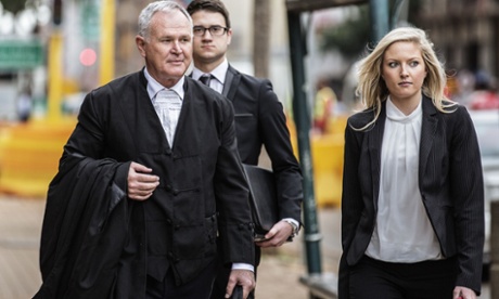 Barry Roux (L), defence lawyer of Oscar Pistorius, arrives at the high court in Pretoria this morning.