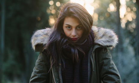 Portrait of attractive young woman in forest