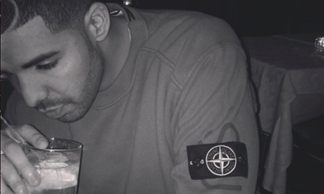 Drake wearing a sweater from the Supreme x Stone Island collaboration