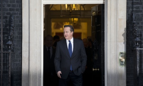 British Prime Minister David Cameron walks out of 10 Downing Street in London, to bid farewell to Afghan President Ashraf Ghani and Pakistan's Prime Minister Nawaz Sharif after their meeting, Friday, Dec. 5, 2014.