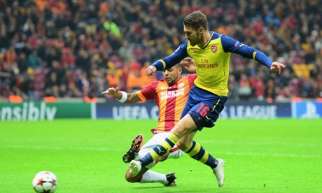 Aaron Ramsey of Arsenal strikes to score his side's second goal against Galatasaray.