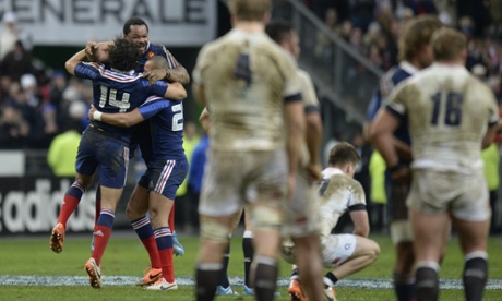 Yoann Huget, Mathieu Bastareaud and matchwinner Gael Fickou celebrate as England players contemplate defeat