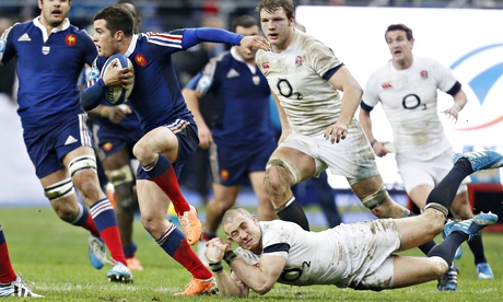 Brice Dulin of France tries to escape the attentions of England's Mike Brown in the Six Nations