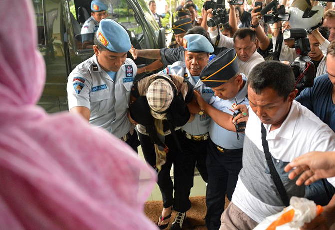 Corby: Schapelle Corby is escorted