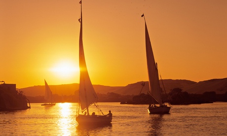 'Life-giving waters': feluccas at sunset on the Nile at Aswan.