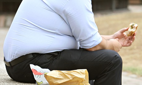 Obese man with burger