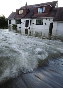 Floodwaters rush into a home in Wraysbury