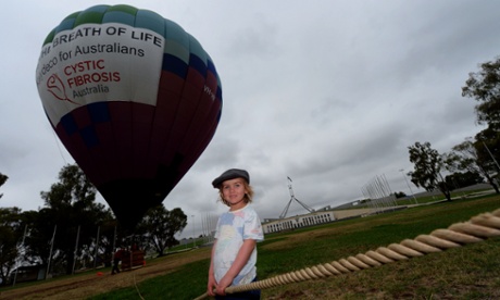 Four year old Ignatius Brierley, who suffers from cystic fibrosis is seen in front of a hot air balloon in front of Parliament House.
