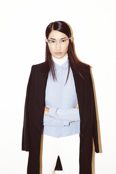 Mix and Match: Woman modelling glasses and navy woolen coat