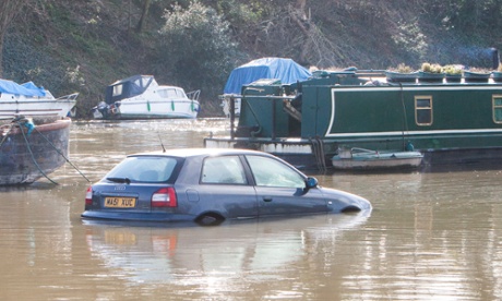 Partially submerged cars at Platts Eyot, Lower Sunbury Road on 11 February, 2014, in Surrey.