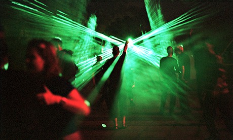 people dancing in front of lasers