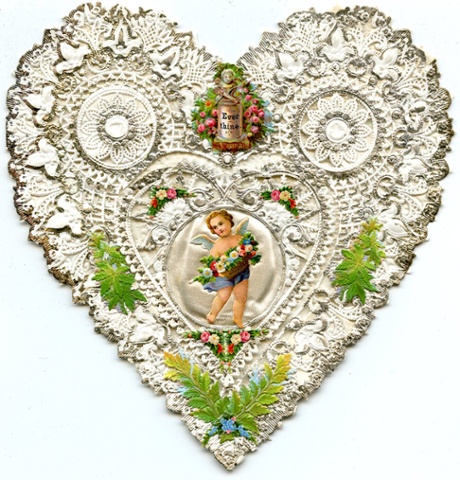 A heart Valentine featuring silver lace and a picture of Cupid, from the late 1850s. Victorian Valentines were sent anonymously and often carried no message to the recipient - it was expected that the Valentine itself would be message enough