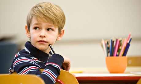 Boy writing primary school