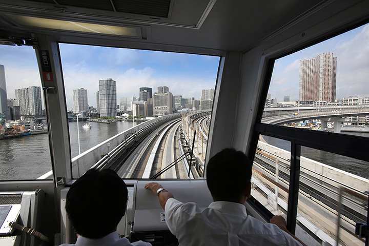 Top 10 trains: Tokyo commuters ride in a train across the Rainbow Bridge
