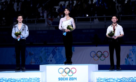 Patrick Chan of Canada poses after winning the silver, Yuzuru Hanyu of Japan after winning the gold and Denis Ten of Kazakhstan after winning the bronze in the men's figure skating.