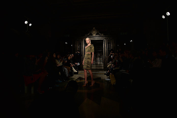 20 Photos: A model presents a design from Felder Felder at London Fashion Week